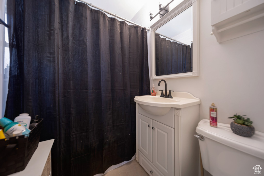 Full bath featuring toilet and vanity