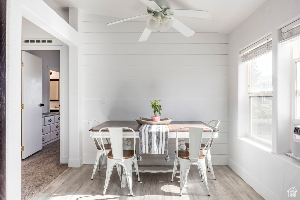 Dining area featuring a ceiling fan and wood finished floors