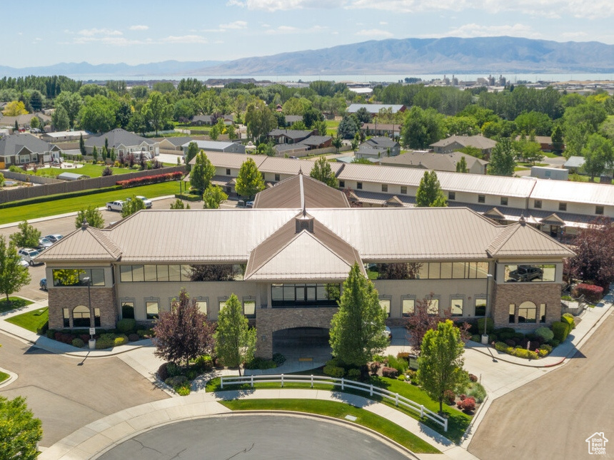 Aerial perspective of suburban area featuring a mountain backdrop