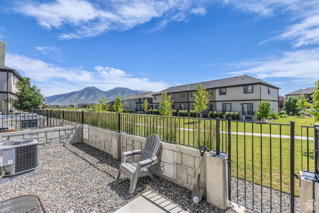 Fenced backyard with a residential view and a mountain view