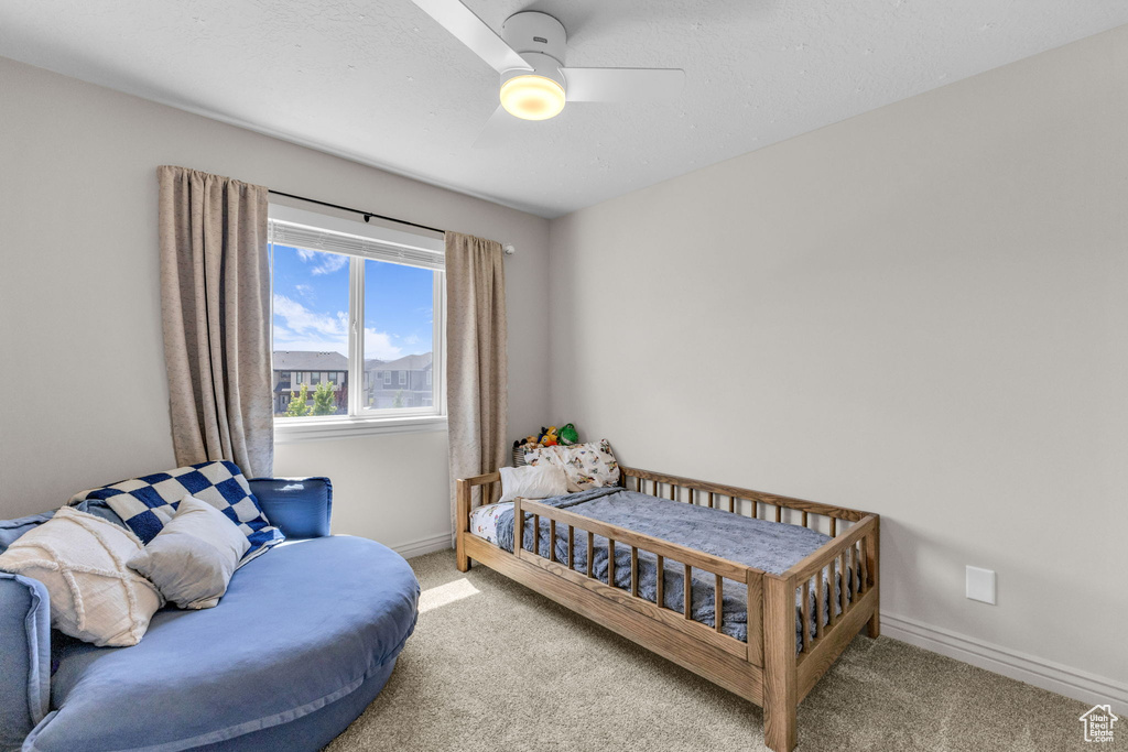 Bedroom featuring carpet floors and ceiling fan