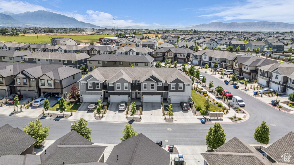 Aerial view of residential area featuring a mountain backdrop