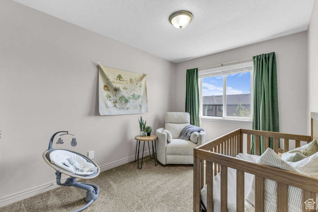 Carpeted bedroom with baseboards