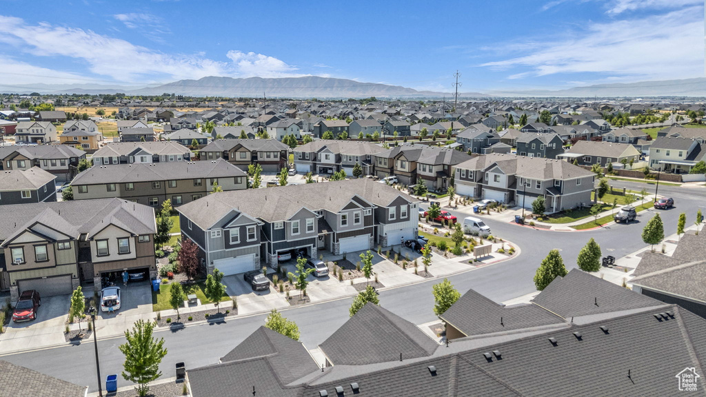 Aerial view of residential area featuring a mountainous background