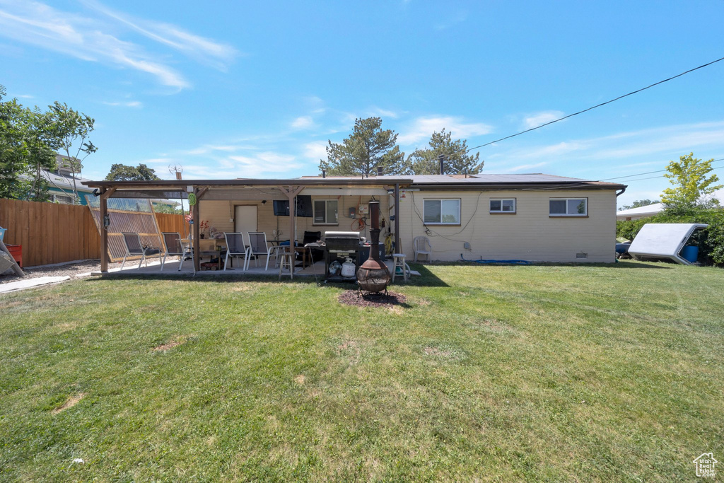 Back of house with a patio