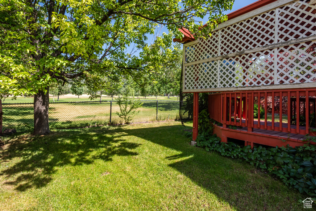View of yard featuring a wooden deck