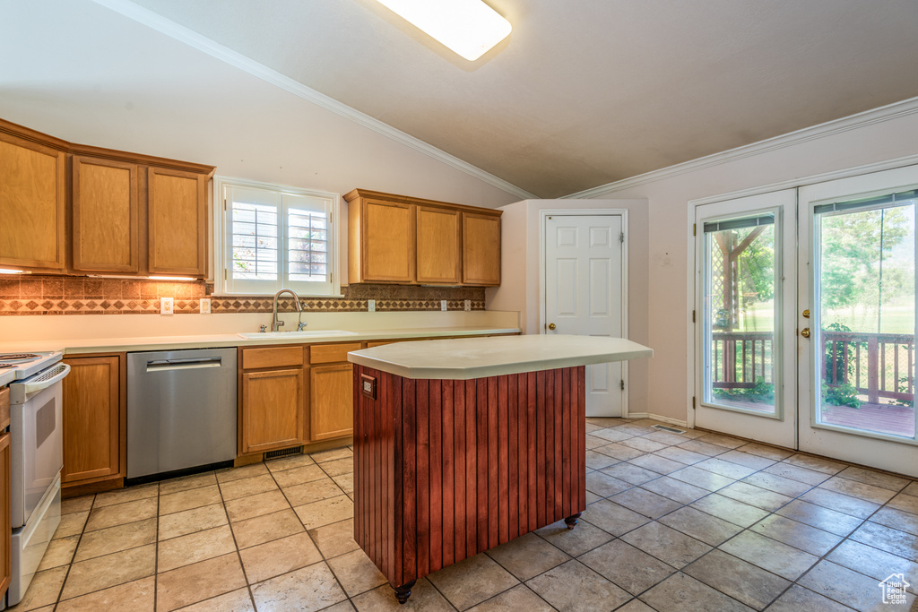 Kitchen with dishwasher, white range with electric stovetop, backsplash, lofted ceiling, and light countertops