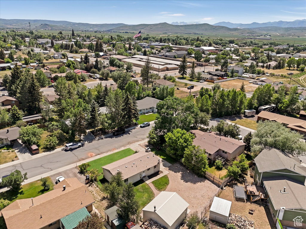 Aerial perspective of suburban area featuring a mountainous background