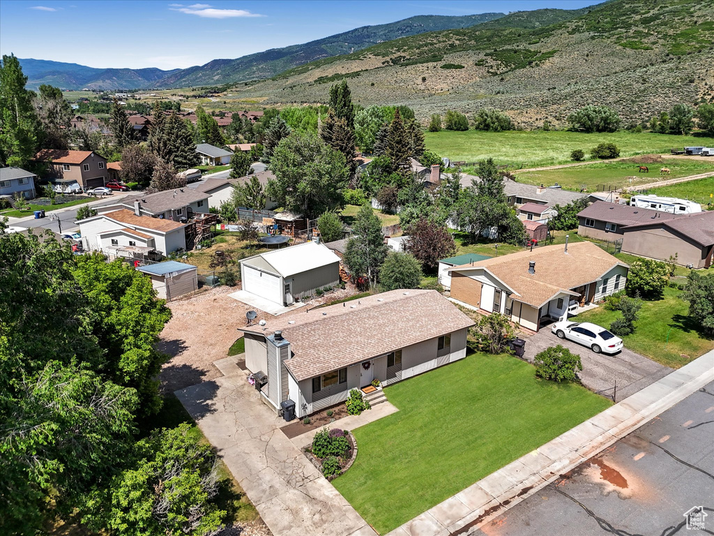 Aerial view of residential area with a mountain backdrop