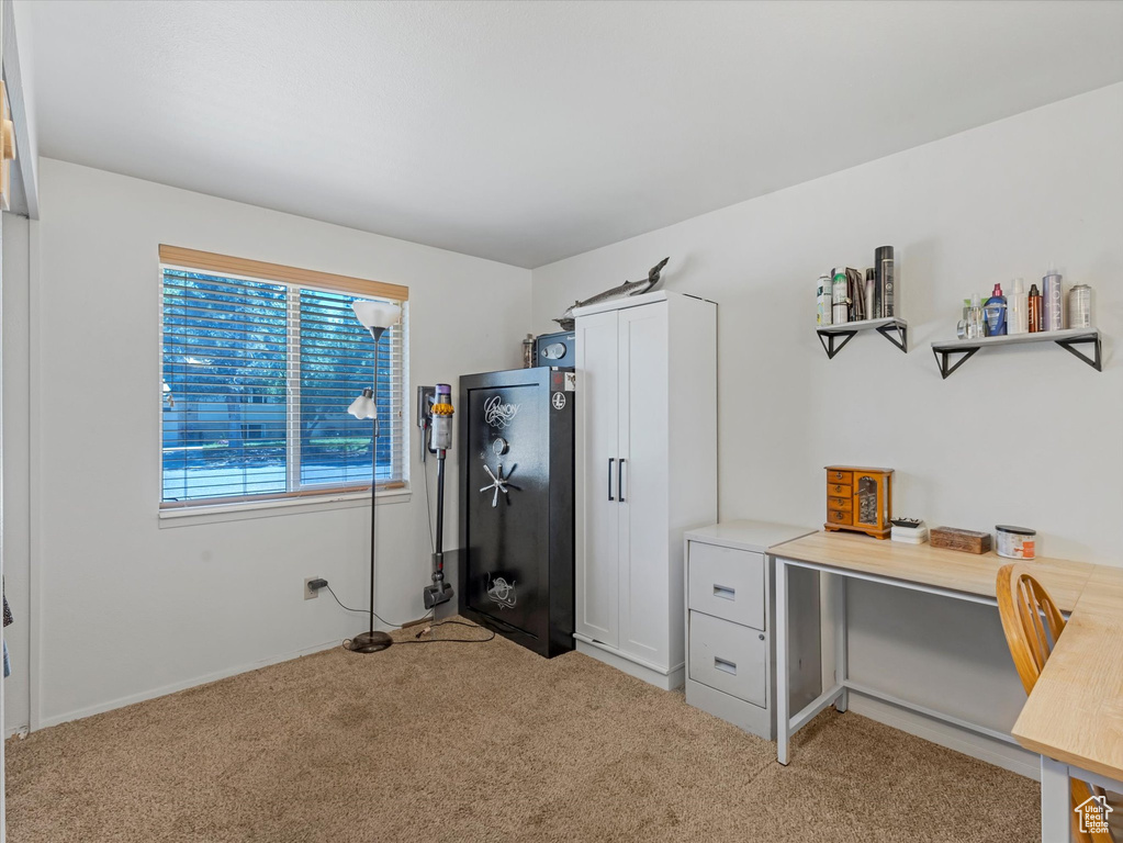 Office space featuring light colored carpet