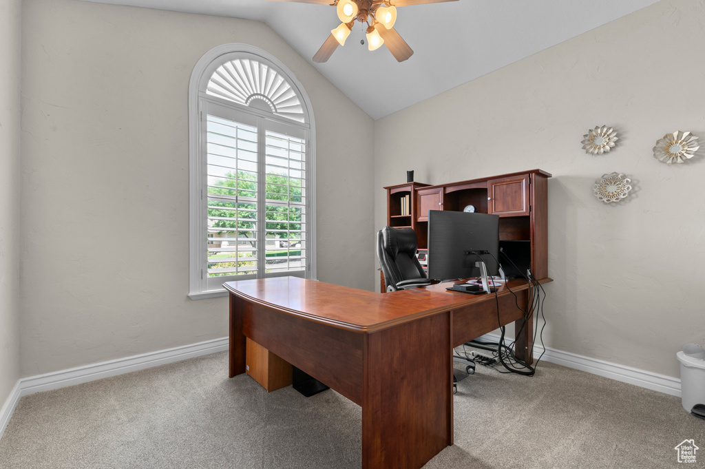 Office area with ceiling fan, lofted ceiling, and carpet