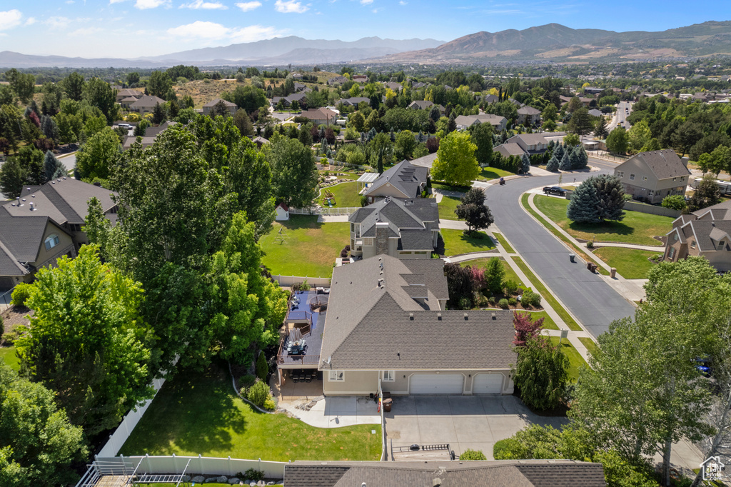 Aerial view of residential area featuring mountains
