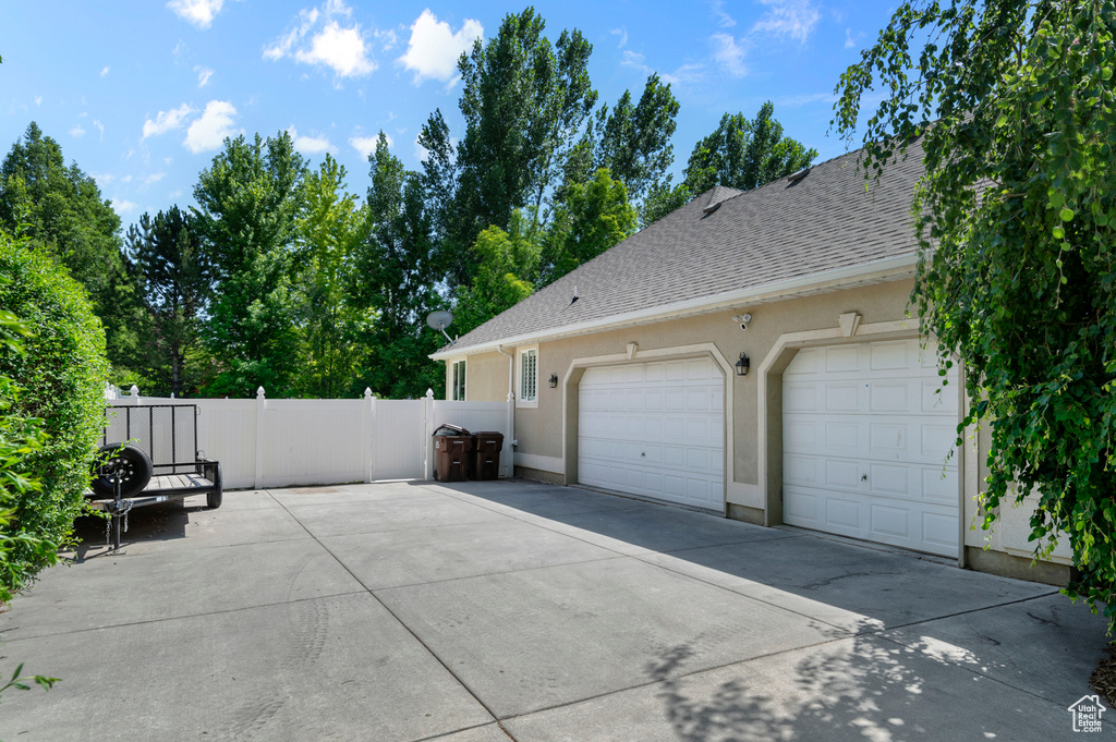 Garage with concrete driveway