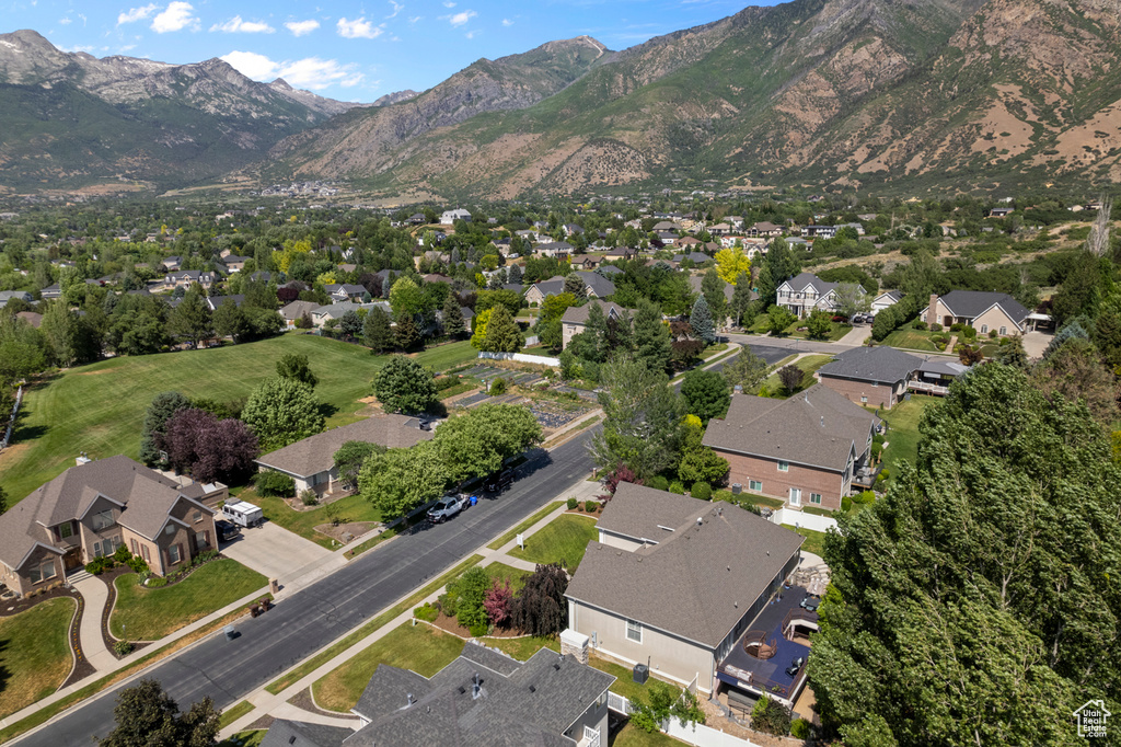 Aerial overview of property\\\'s location with nearby suburban area and a mountain backdrop