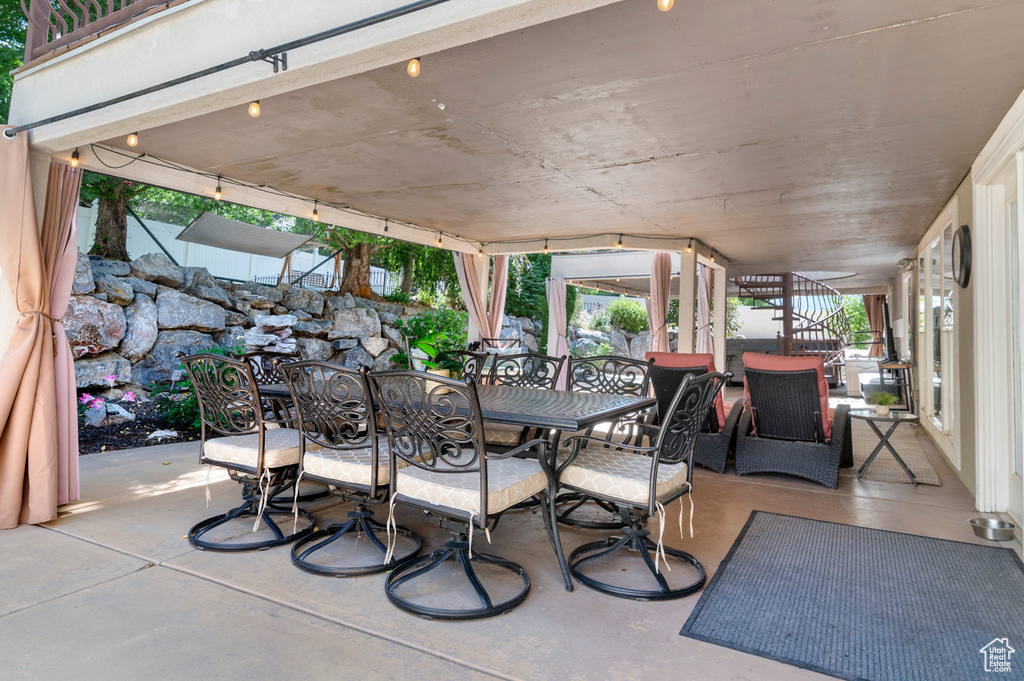 View of patio / terrace with outdoor dining area and stairway