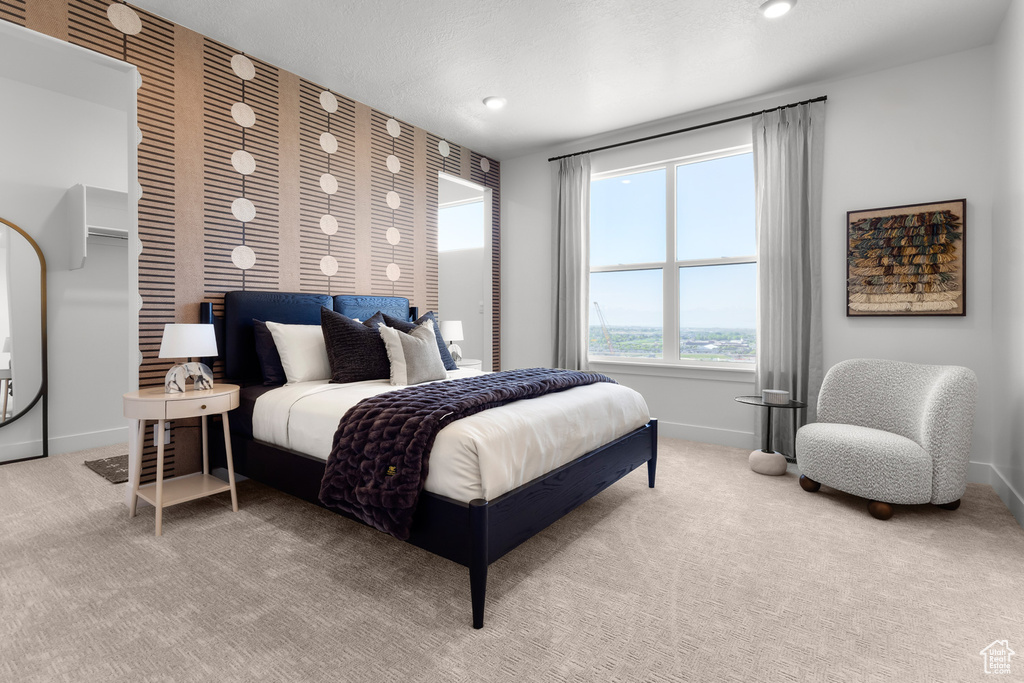 Carpeted bedroom with baseboards