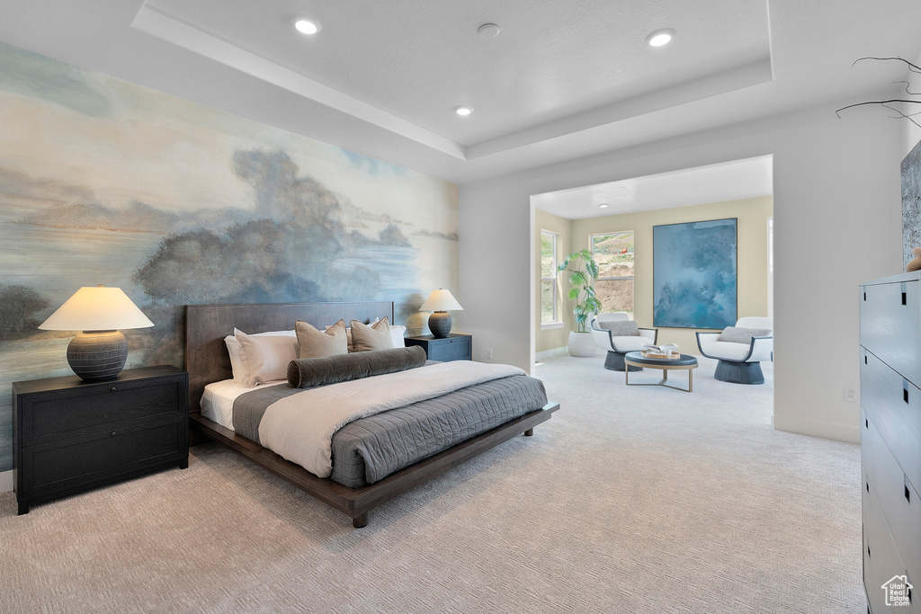 Bedroom featuring carpet, recessed lighting, and a raised ceiling