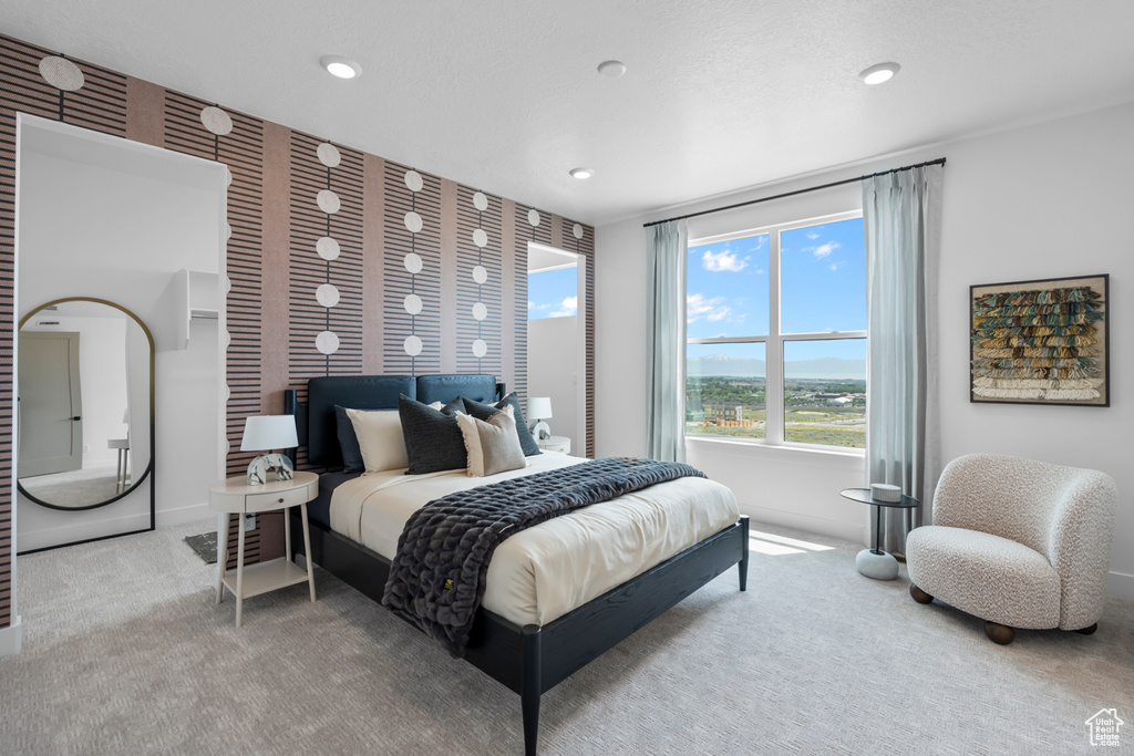 Carpeted bedroom with baseboards and recessed lighting