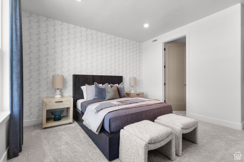 Carpeted bedroom featuring baseboards and recessed lighting