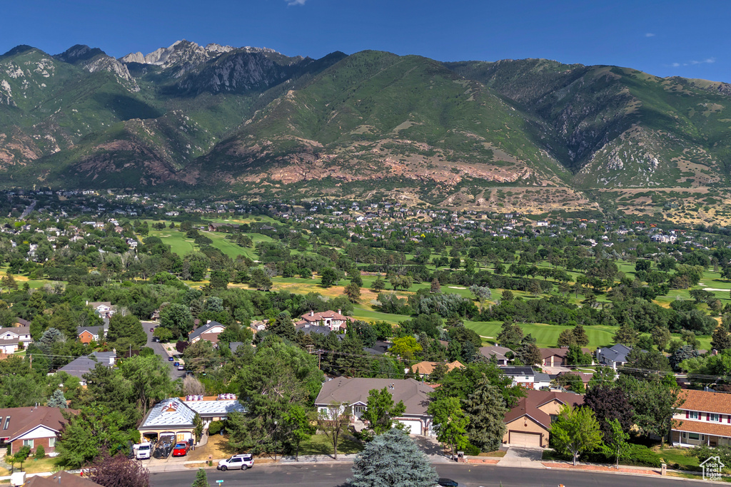 Aerial perspective of suburban area with a mountain backdrop