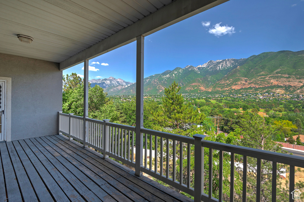 Wooden deck featuring a mountain view