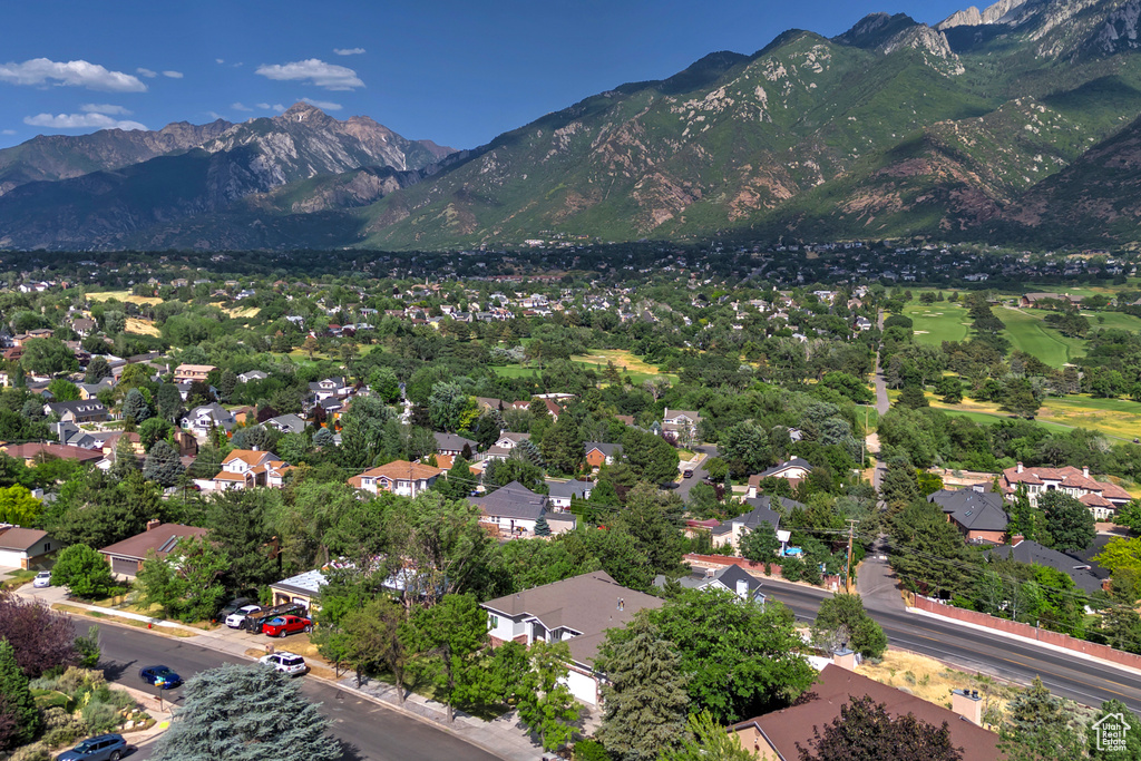 Aerial view of residential area featuring a mountainous background