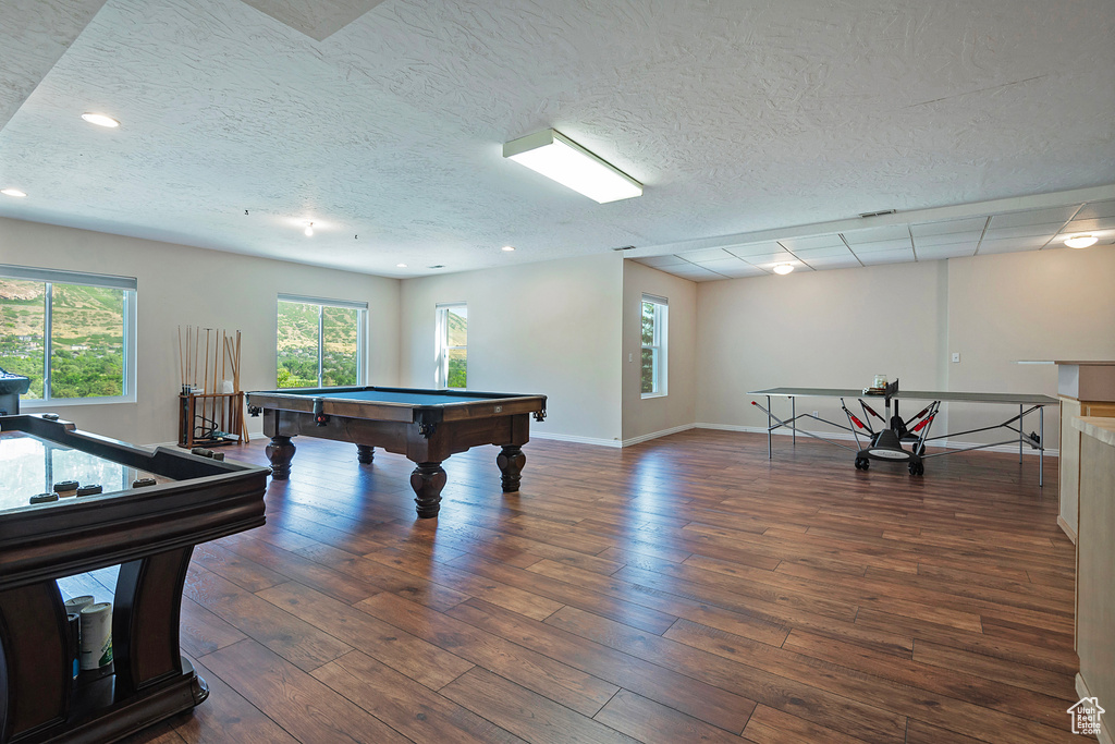 Recreation room featuring pool table, wood finished floors, recessed lighting, and a textured ceiling