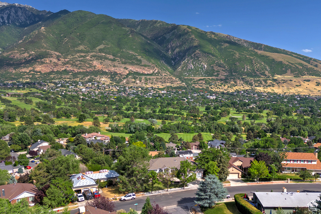 View of property location featuring a mountain backdrop and nearby suburban area