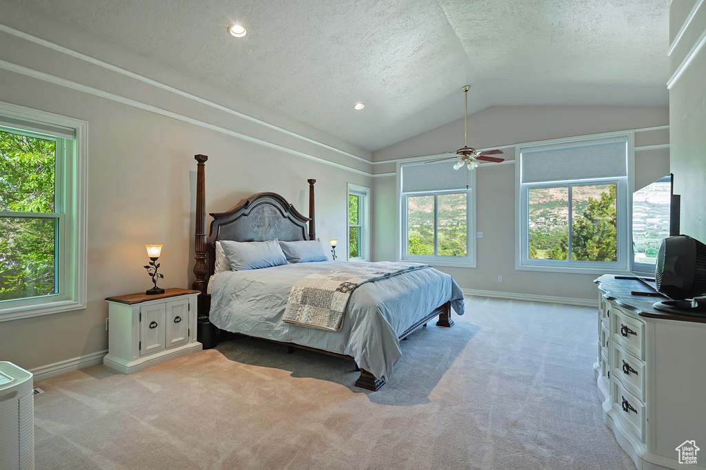 Bedroom featuring lofted ceiling, light colored carpet, a textured ceiling, ceiling fan, and recessed lighting