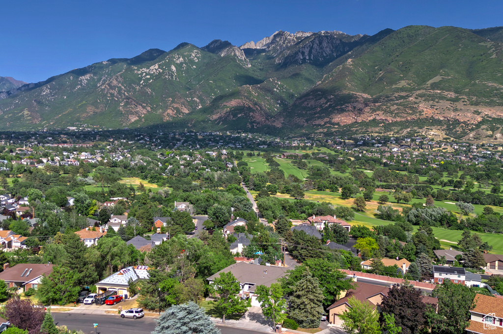 Aerial view of residential area with a mountainous background