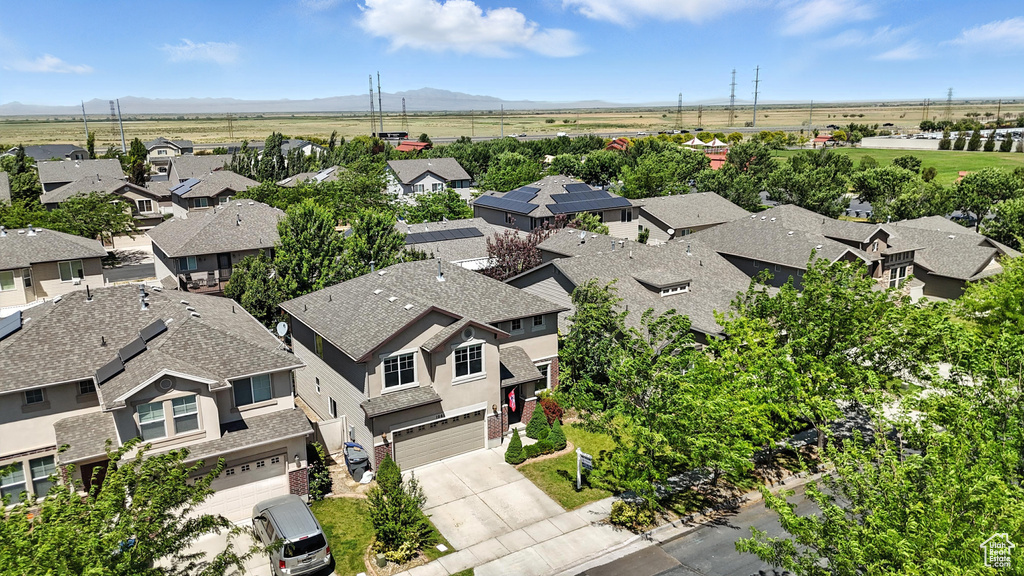 Aerial view of residential area with a mountain backdrop