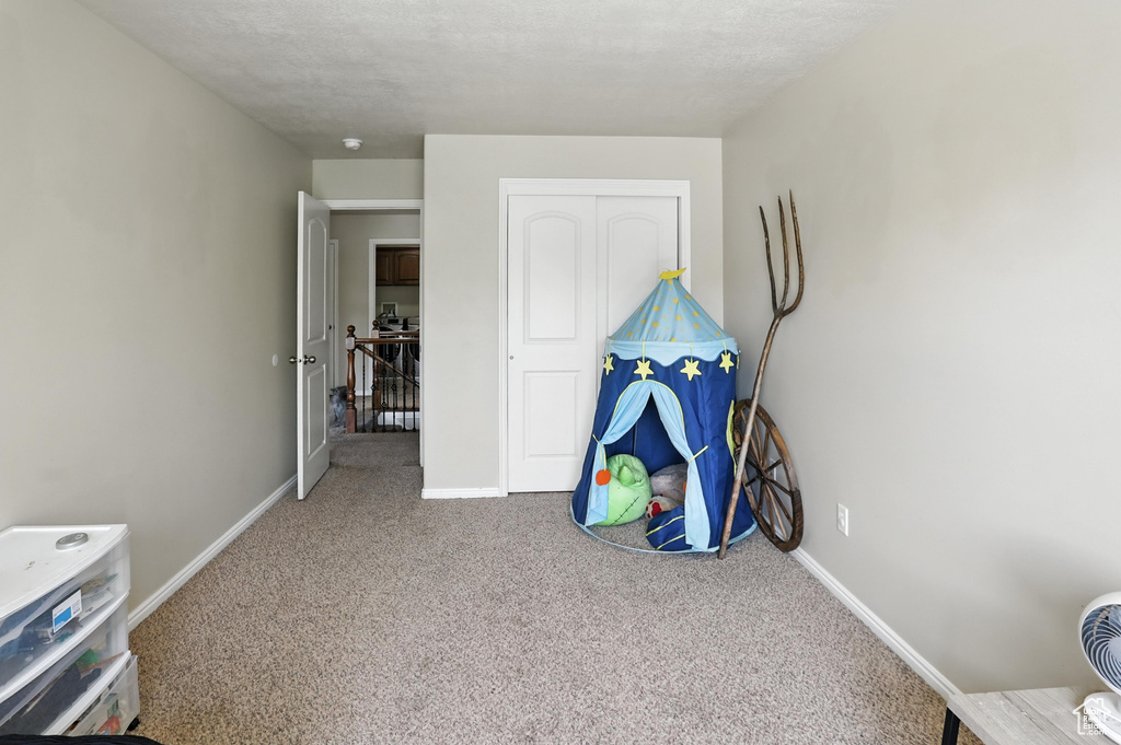 Playroom with carpet flooring and baseboards