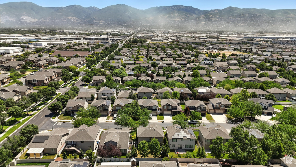 Aerial perspective of suburban area featuring a mountain backdrop