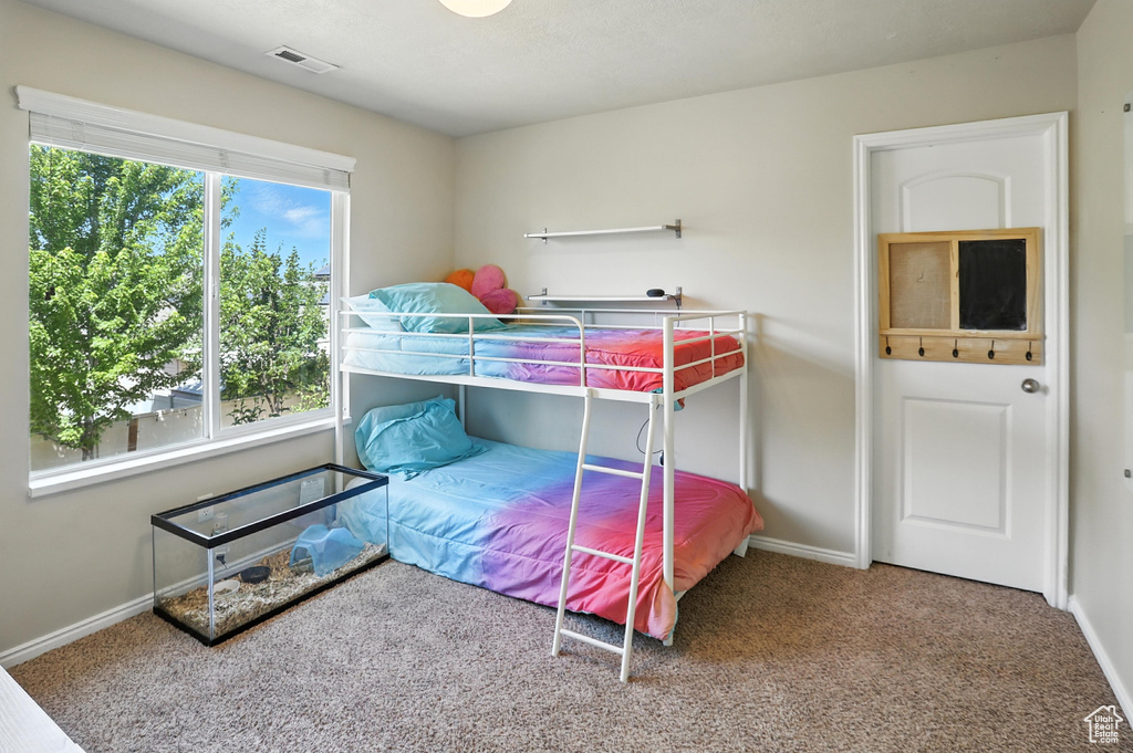 Bedroom with carpet and baseboards