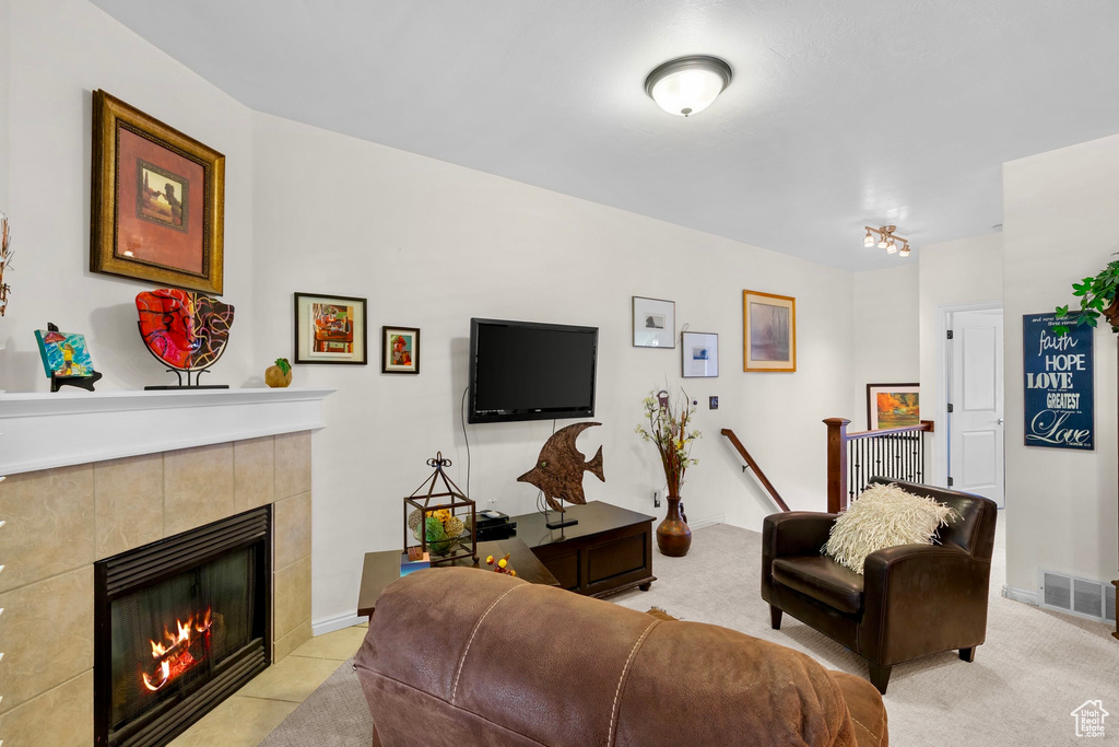 Living area with a tile fireplace