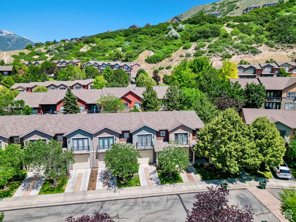 Aerial perspective of suburban area featuring a mountain backdrop