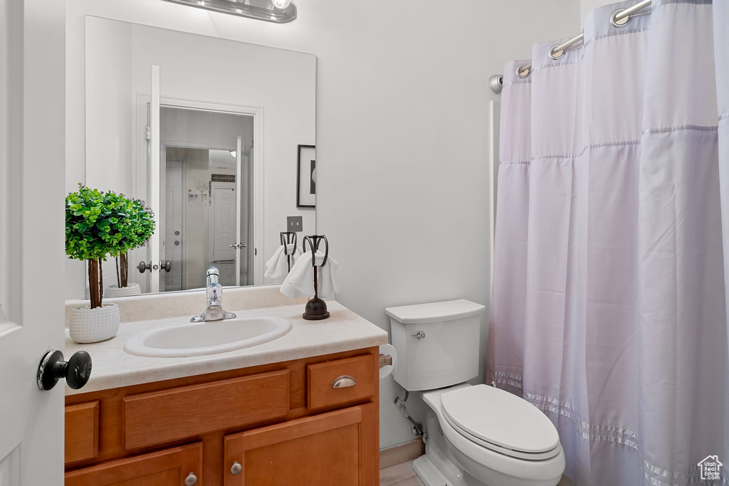 Full bathroom featuring vanity and a shower with shower curtain