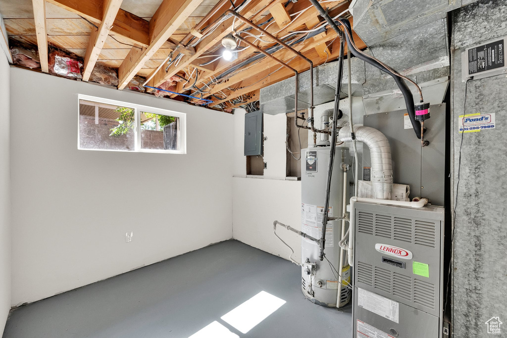 Basement with gas water heater and electric panel