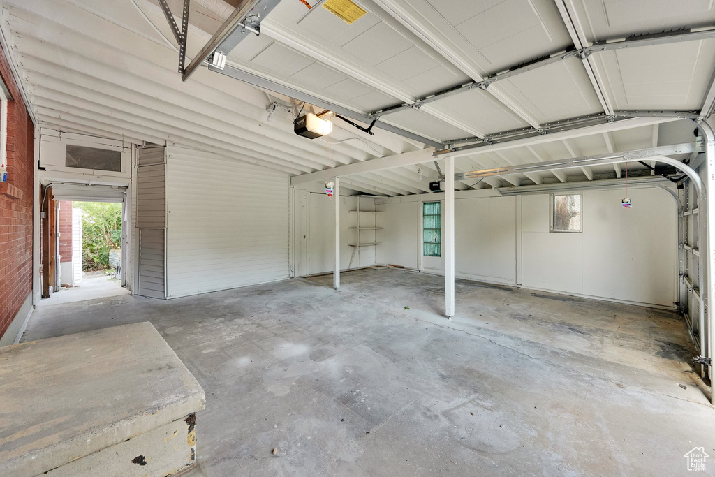Garage featuring a garage door opener