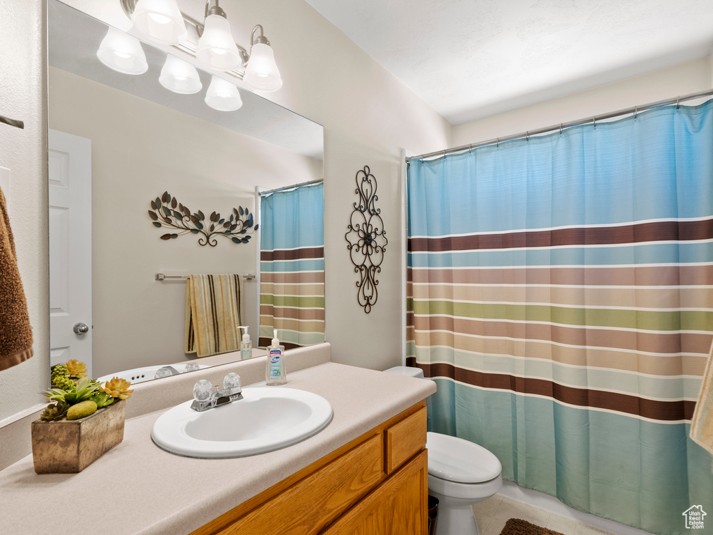 Bathroom with vanity and a shower with curtain