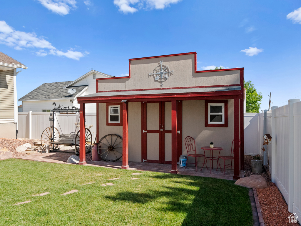View of outbuilding featuring a fenced backyard