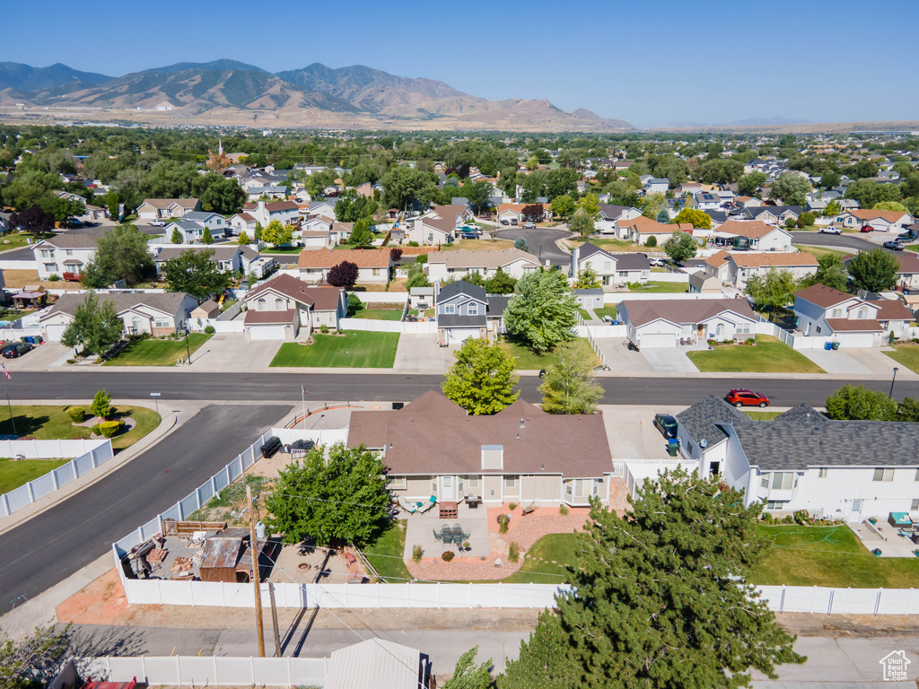 Aerial perspective of suburban area with a mountainous background