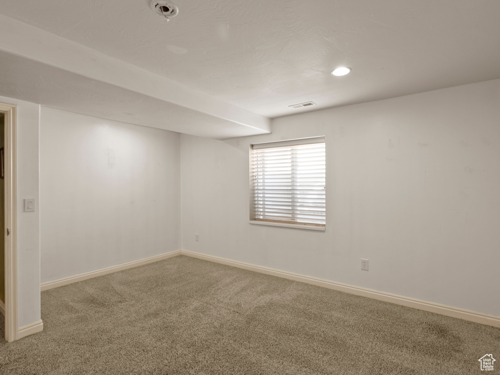 Carpeted spare room with recessed lighting and a pendent fire sprinkler