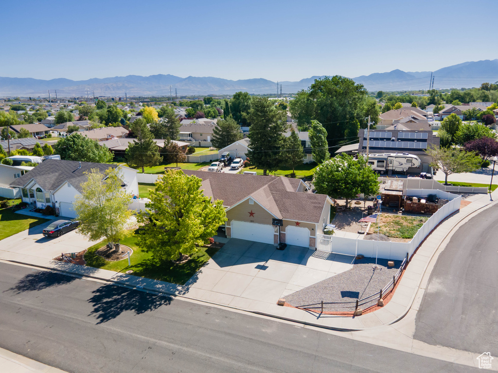 Aerial perspective of suburban area with a mountainous background