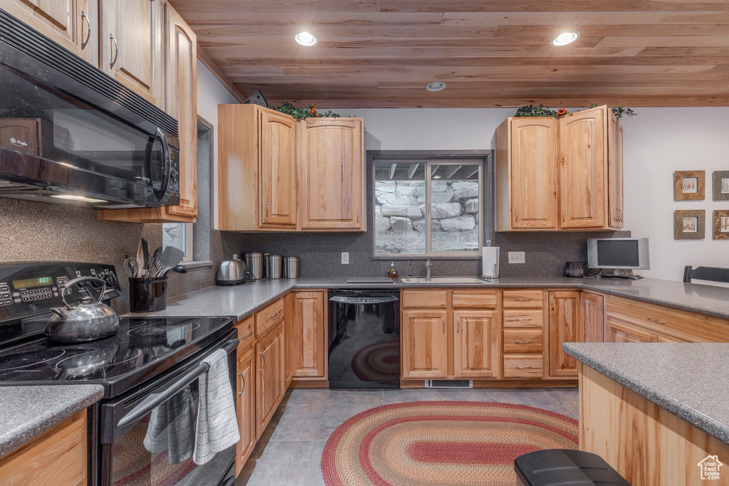 Kitchen featuring black appliances, wood ceiling, tasteful backsplash, recessed lighting, and light brown cabinetry