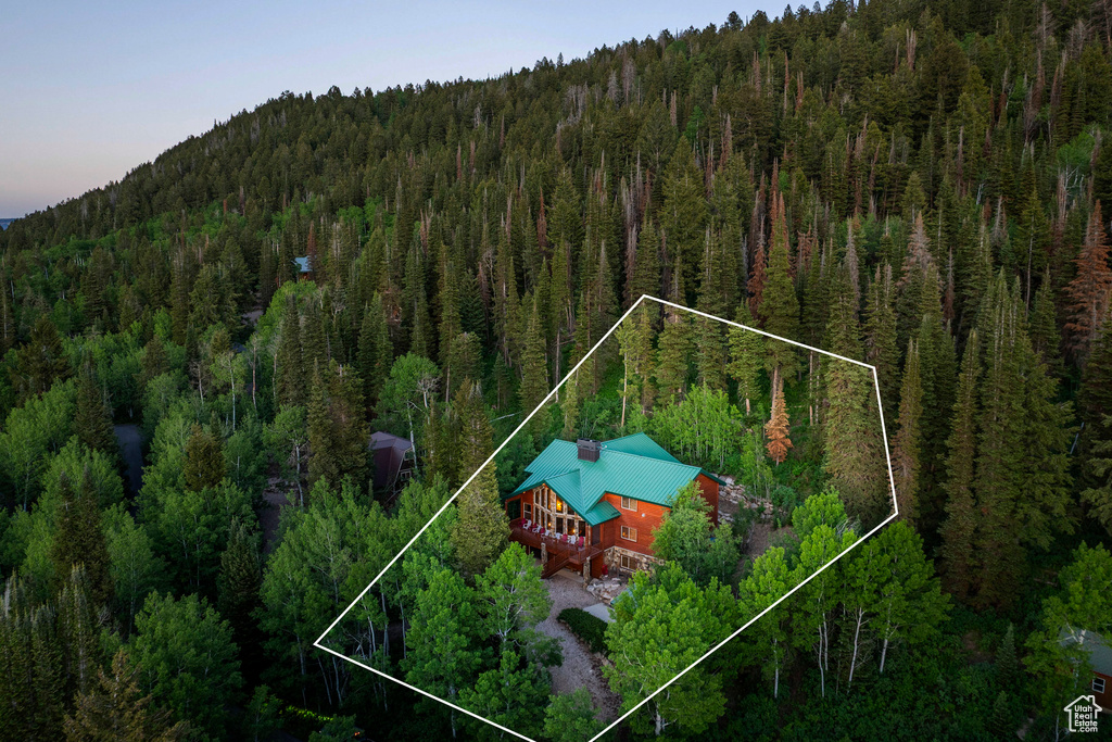 Aerial view of property and surrounding area featuring property boundaries highlighted
