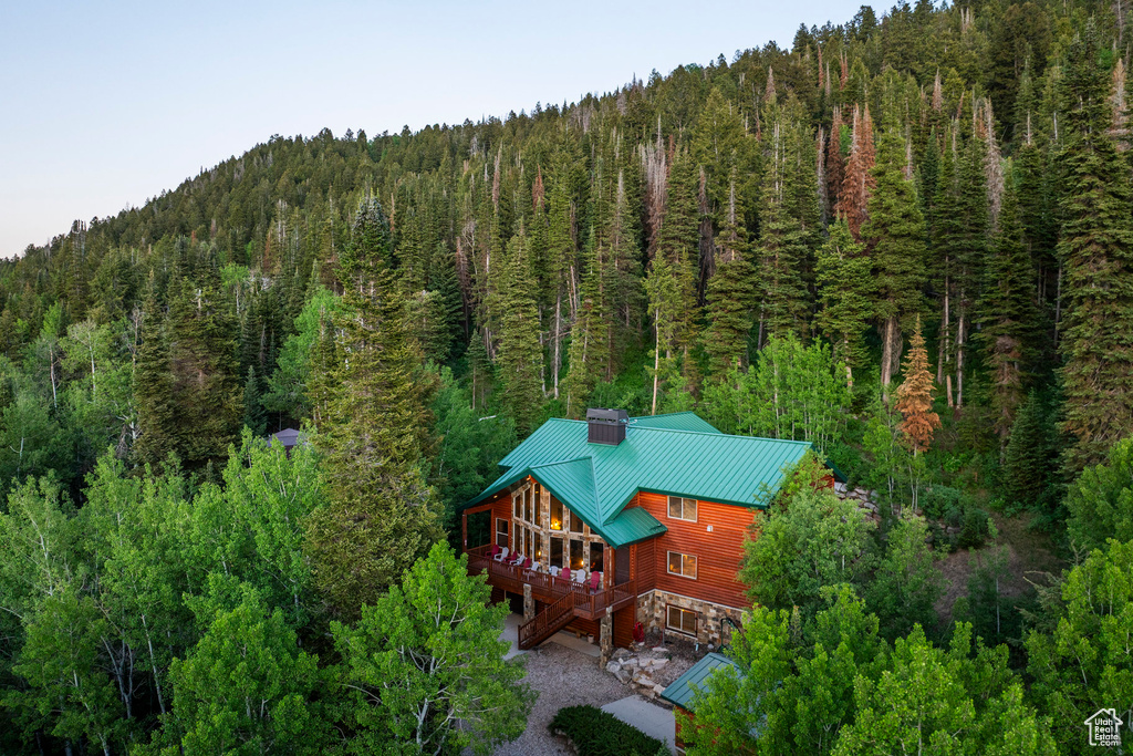 View from above of property with a forest