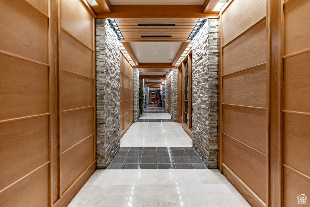 Hallway with tile patterned floors