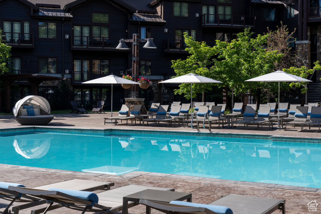 Community pool featuring a patio area