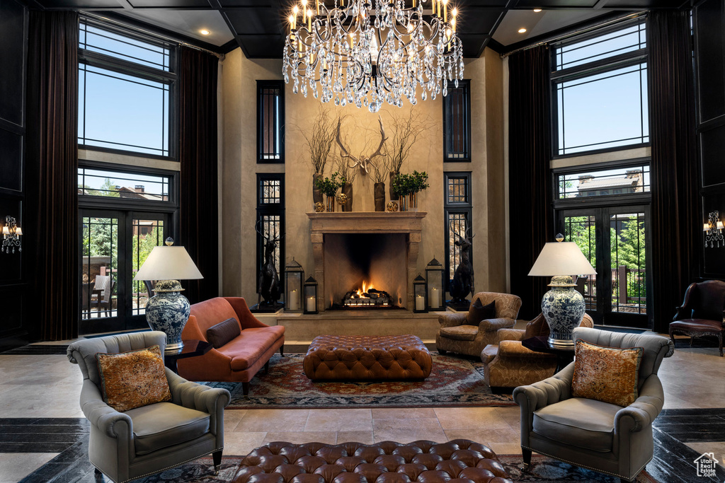 Living area featuring a chandelier and a high ceiling